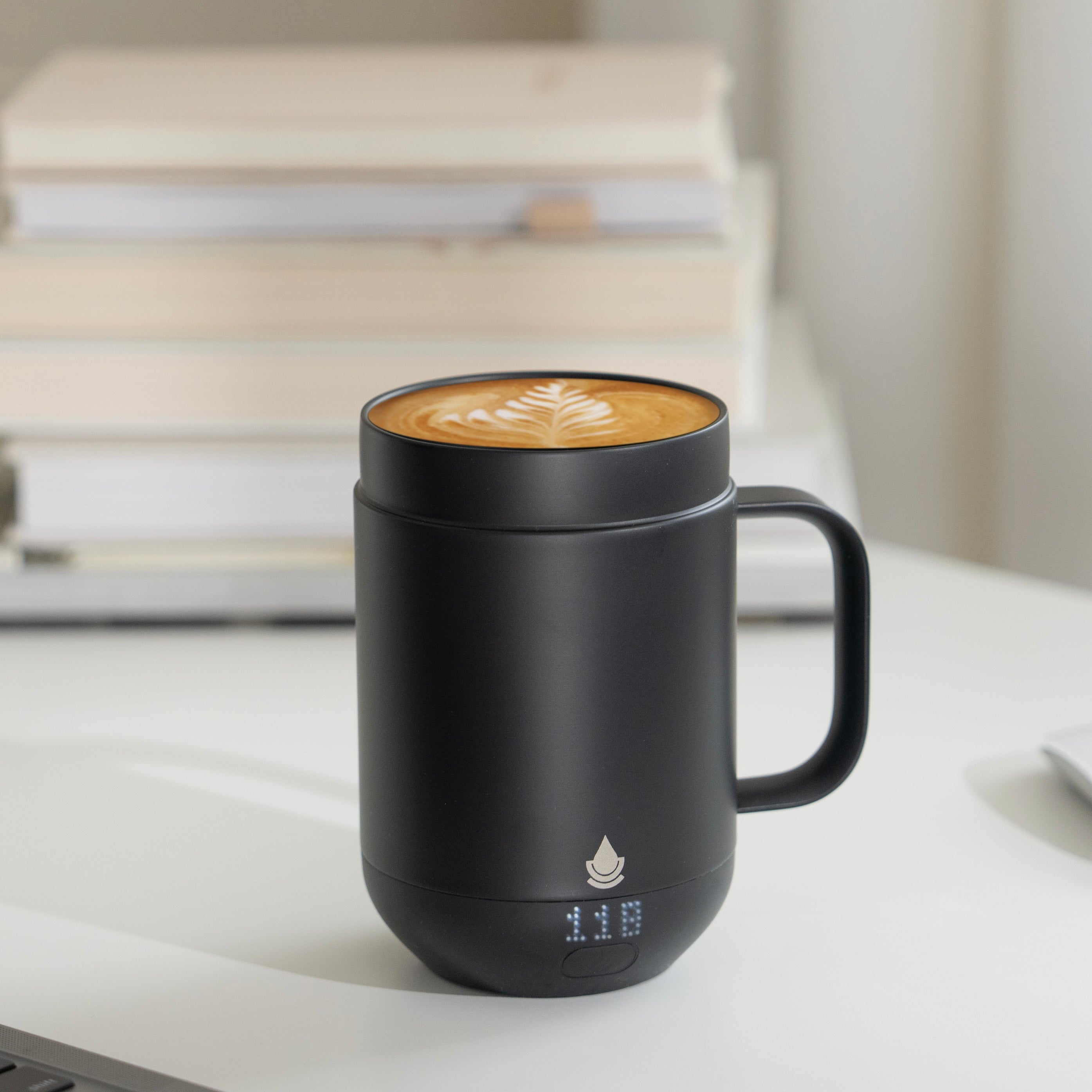 Ciups® Mug sitting on a work desk next to a Macbook Pro Computer