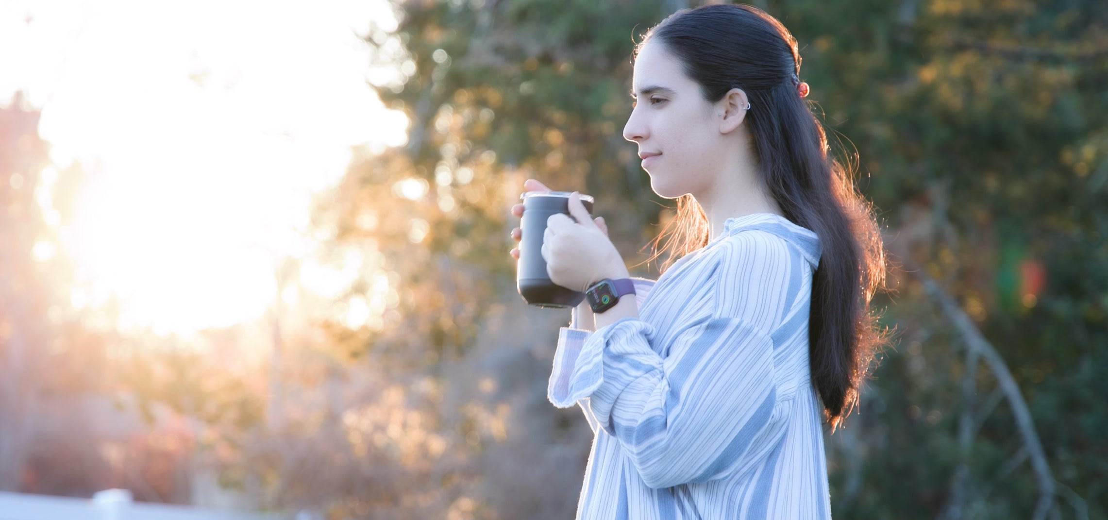 Woman Enjoying A Relaxing Cup Coffee in her Ciups Self Heating Mug